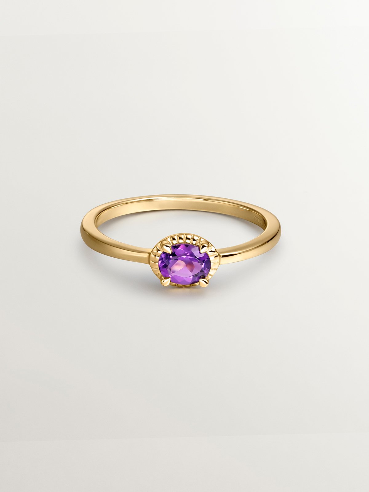 925 Silver ring bathed in 18K yellow gold with purple amethyst stone.
