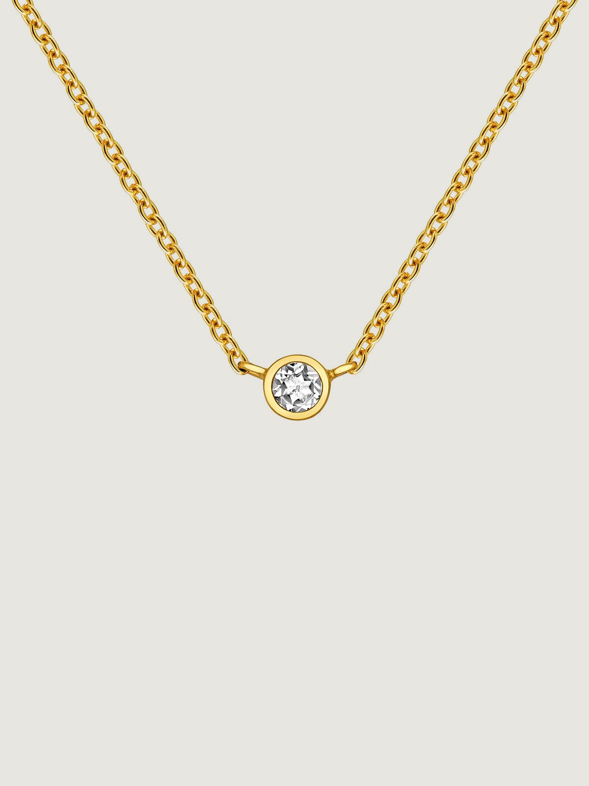 Single 925 silver pendant bathed in 18K yellow gold with white topaz