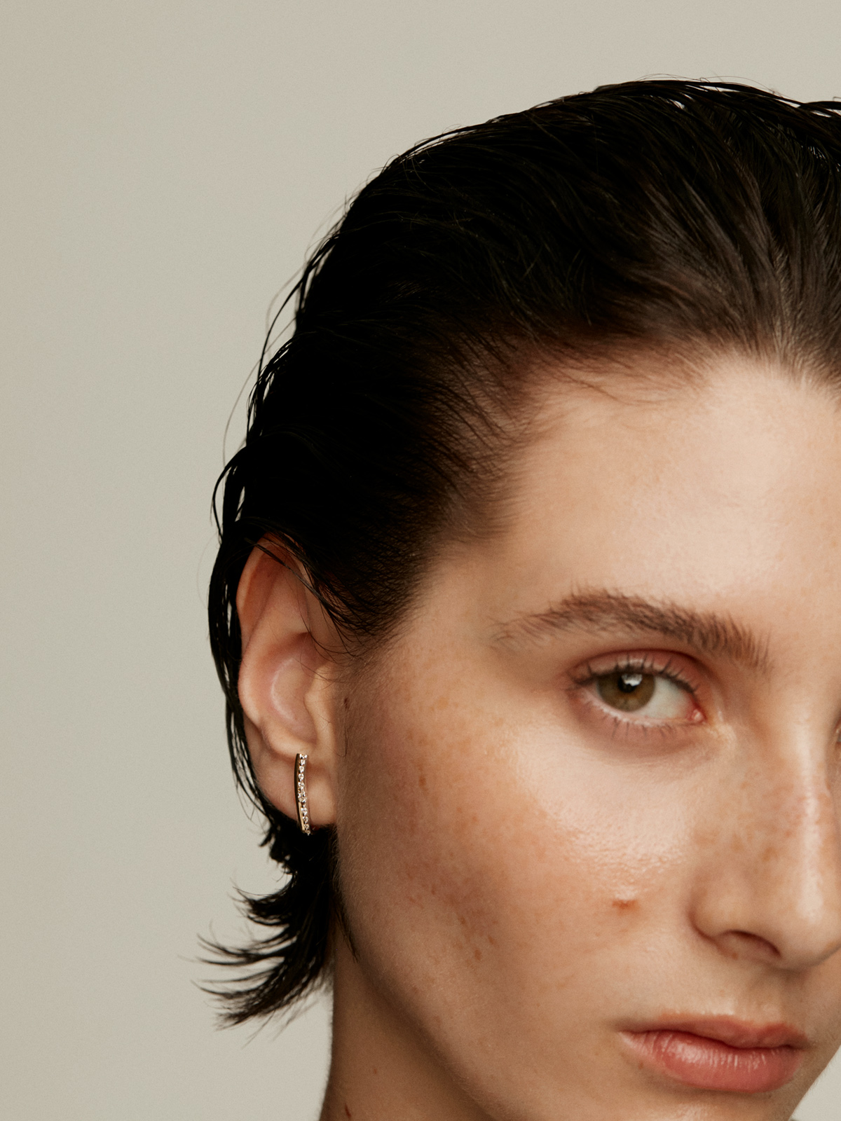 Right individual climber earring made of 18K yellow and white gold with diamonds.