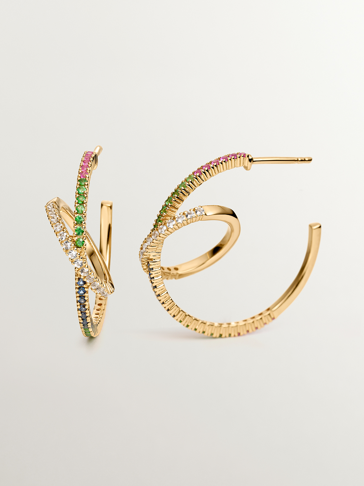Dual hoop earrings made of 925 silver, bathed in 18K yellow gold with tsavorites and multicolored sapphires.