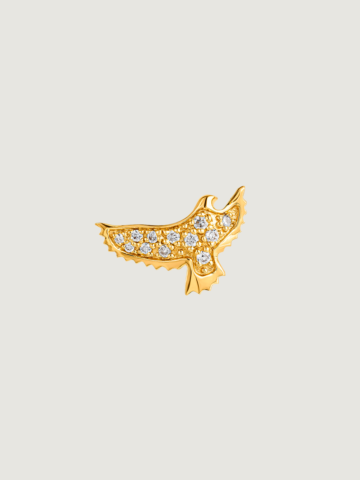 Individual 18K yellow gold earring in the shape of an eagle with diamonds.