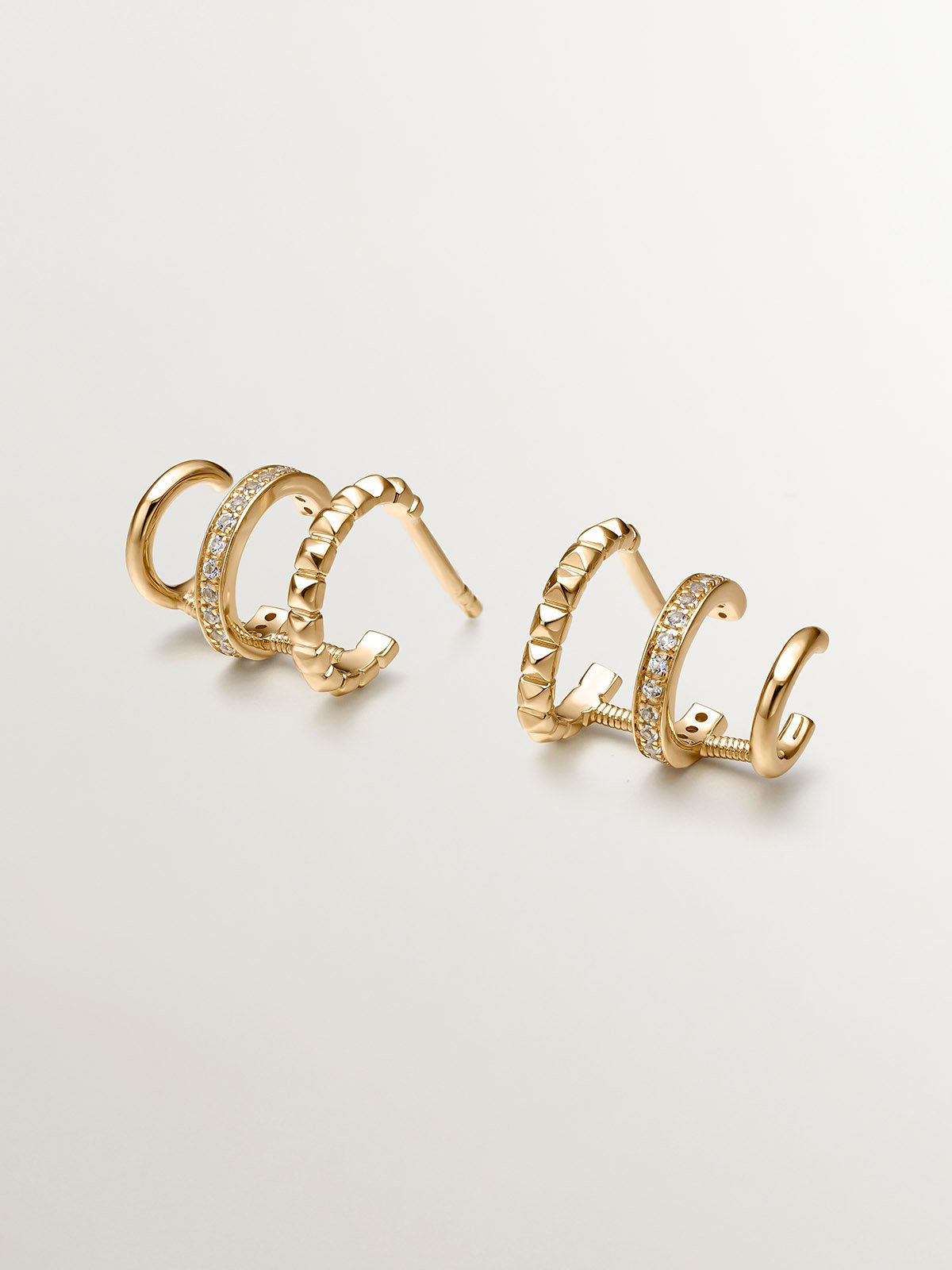 925 Silver Climber Earrings bathed in 18K Yellow Gold with White Topaz.