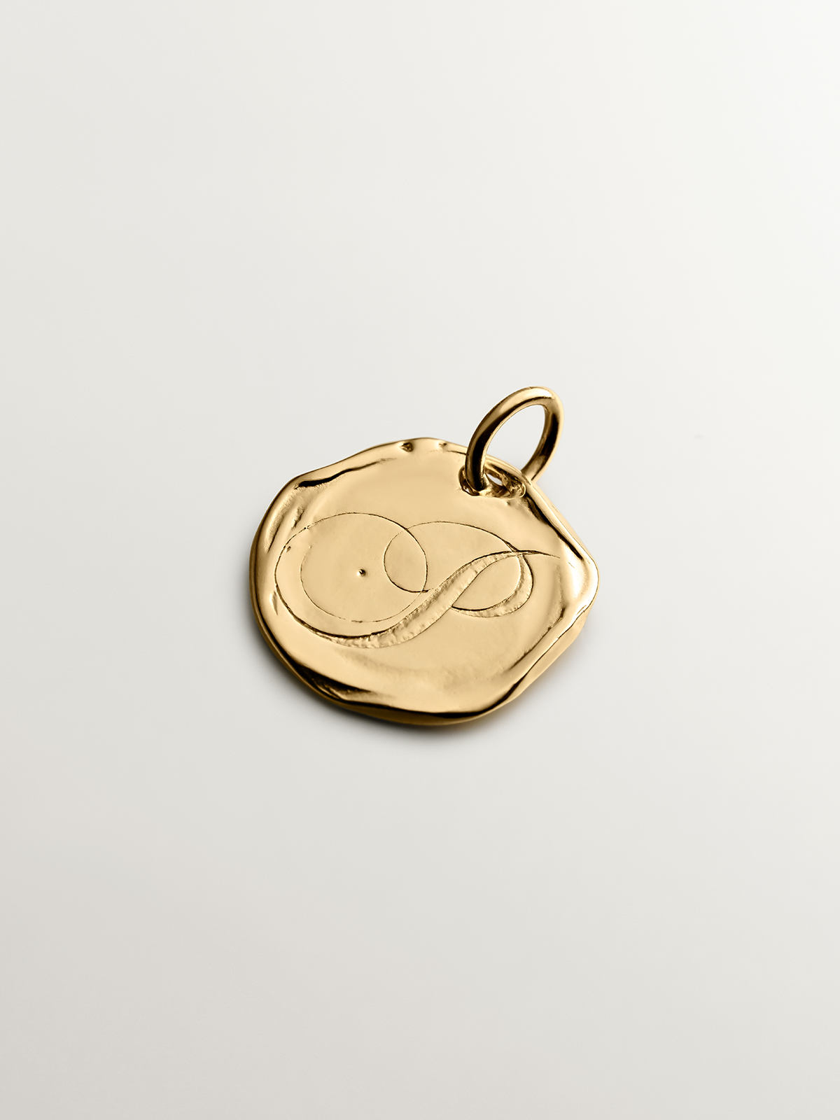 Handcrafted 925 silver charm bathed in 18K yellow gold with initial P.