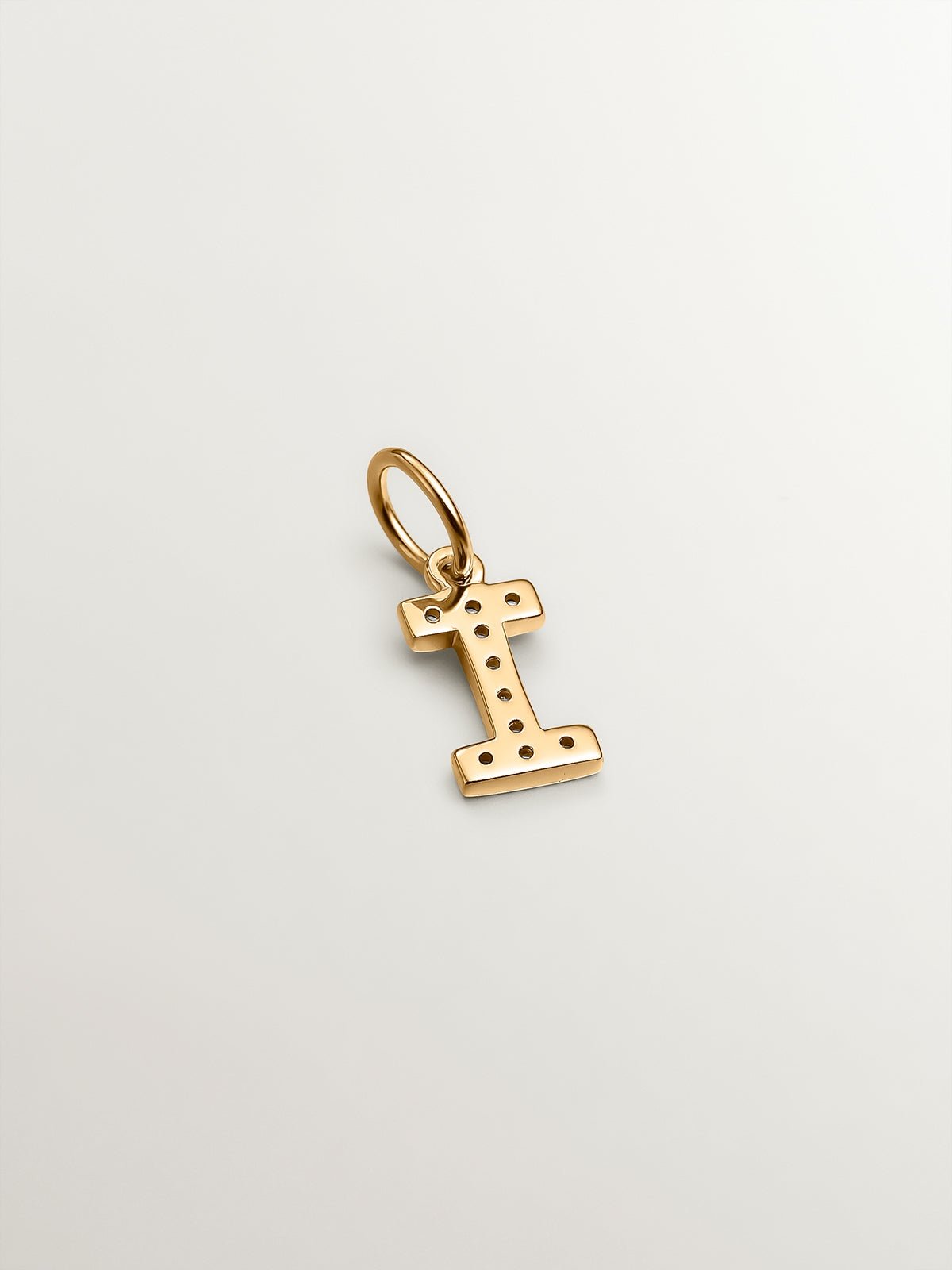 I Initial charm made of 925 silver, bathed in 18K yellow gold, and white topaz.