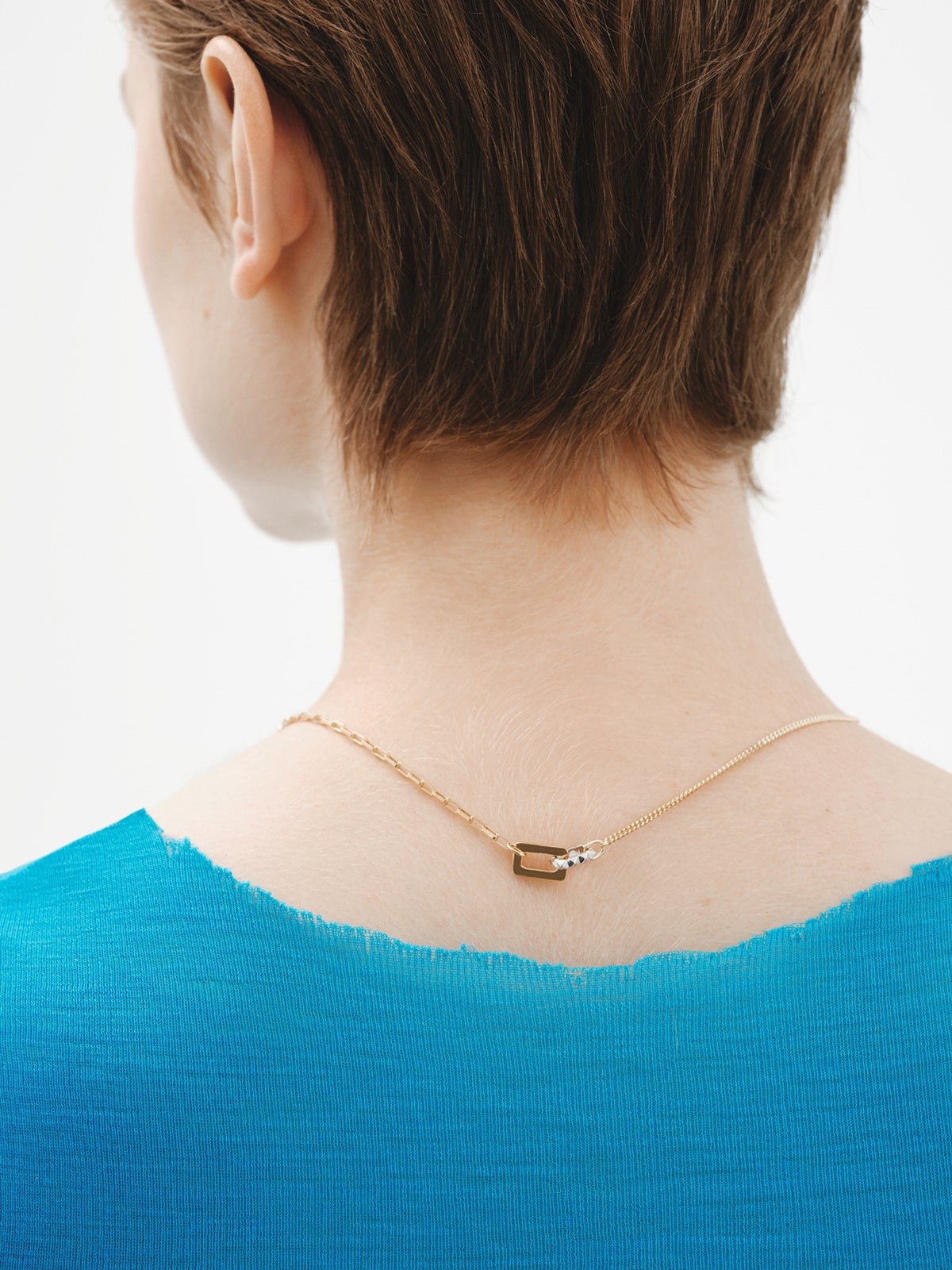 Bicolor pendant of 925 silver and 925 silver bathed in 18K yellow gold with geometric shapes.