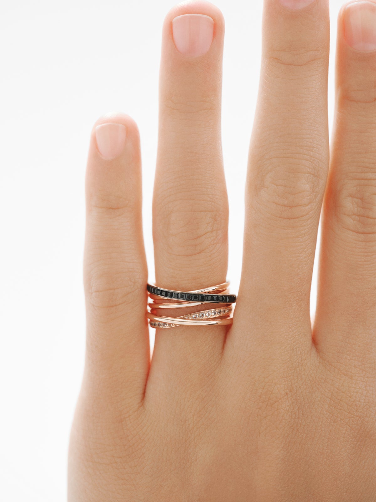 Bague multi-bras en argent 925 plaqué or rose 18K avec topazes blanches et spinelles noires.