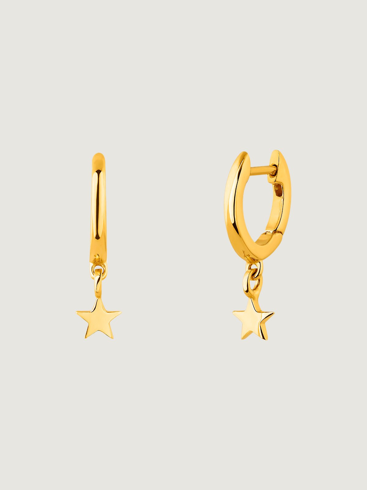 Small hoop earrings made of 925 silver, bathed in 18K yellow gold with star.