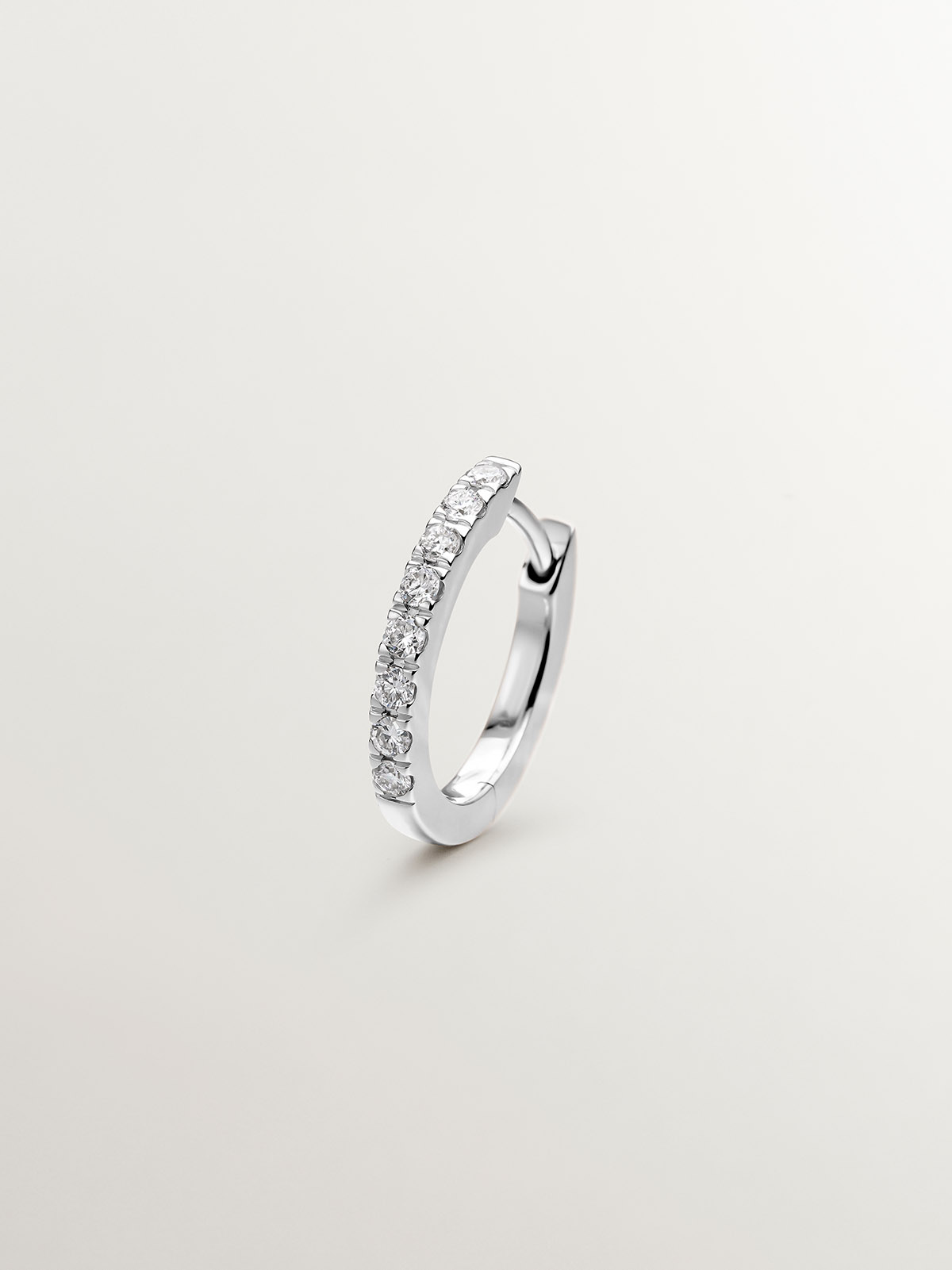 18K white gold small hoop single earring with diamonds.