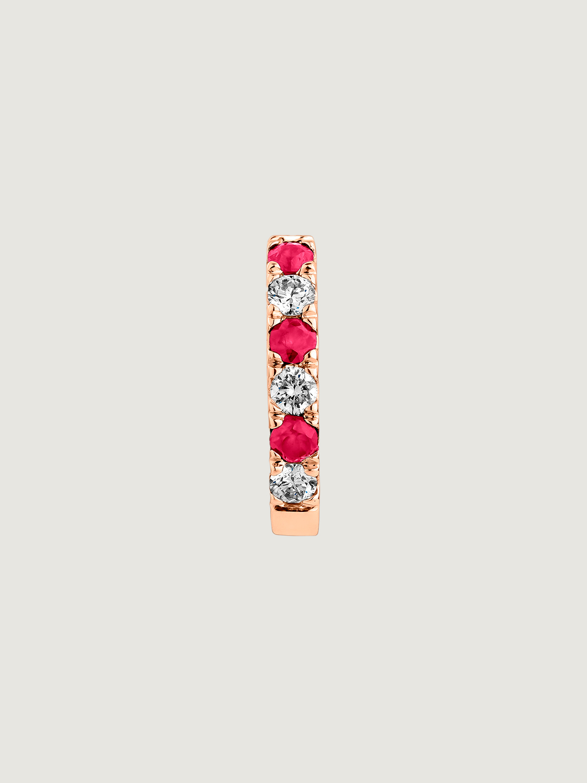 Single 9K rose gold hoop earring with rubies and diamonds.