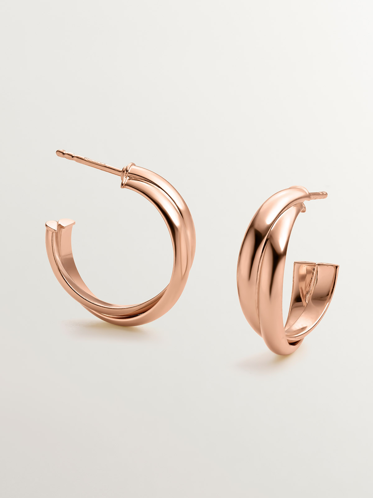 Medium double hoop earrings made of 925 silver, coated in 18K rose gold.