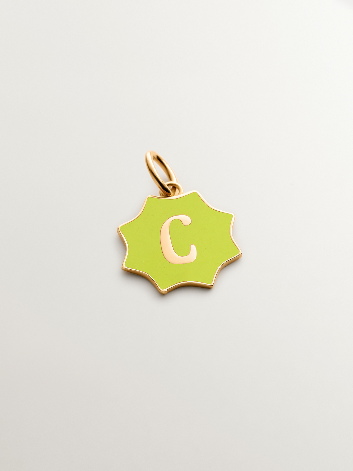 18K yellow gold plated 925 sterling silver charm with star-shaped yellow enamel initial C