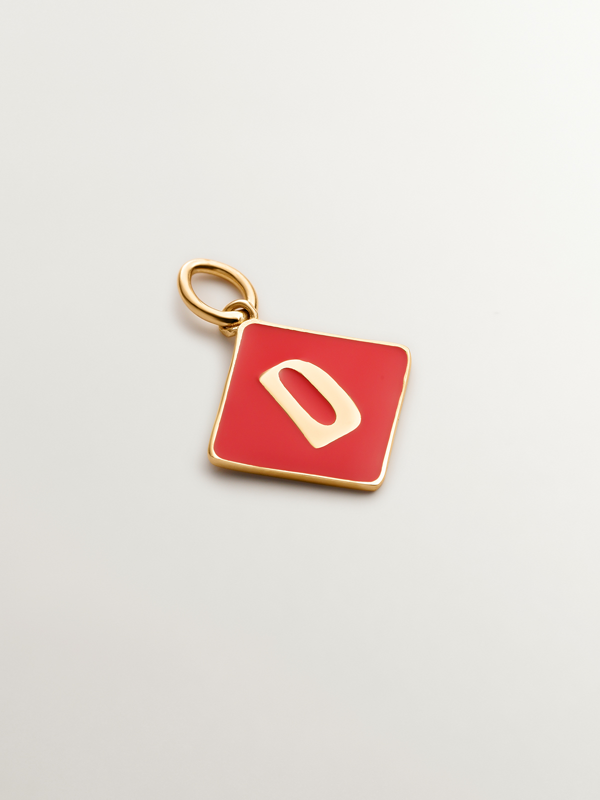 18K yellow gold plated 925 sterling silver charm with initial D and red enamel in diamond shape