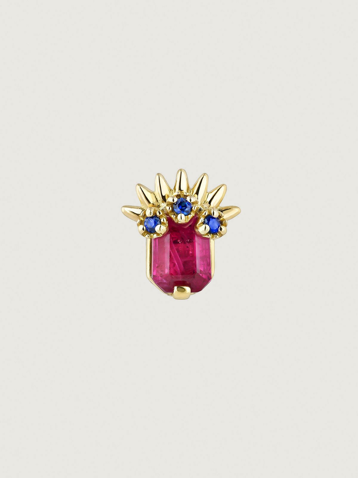 18K Yellow gold piercing with ruby and blue sapphires.