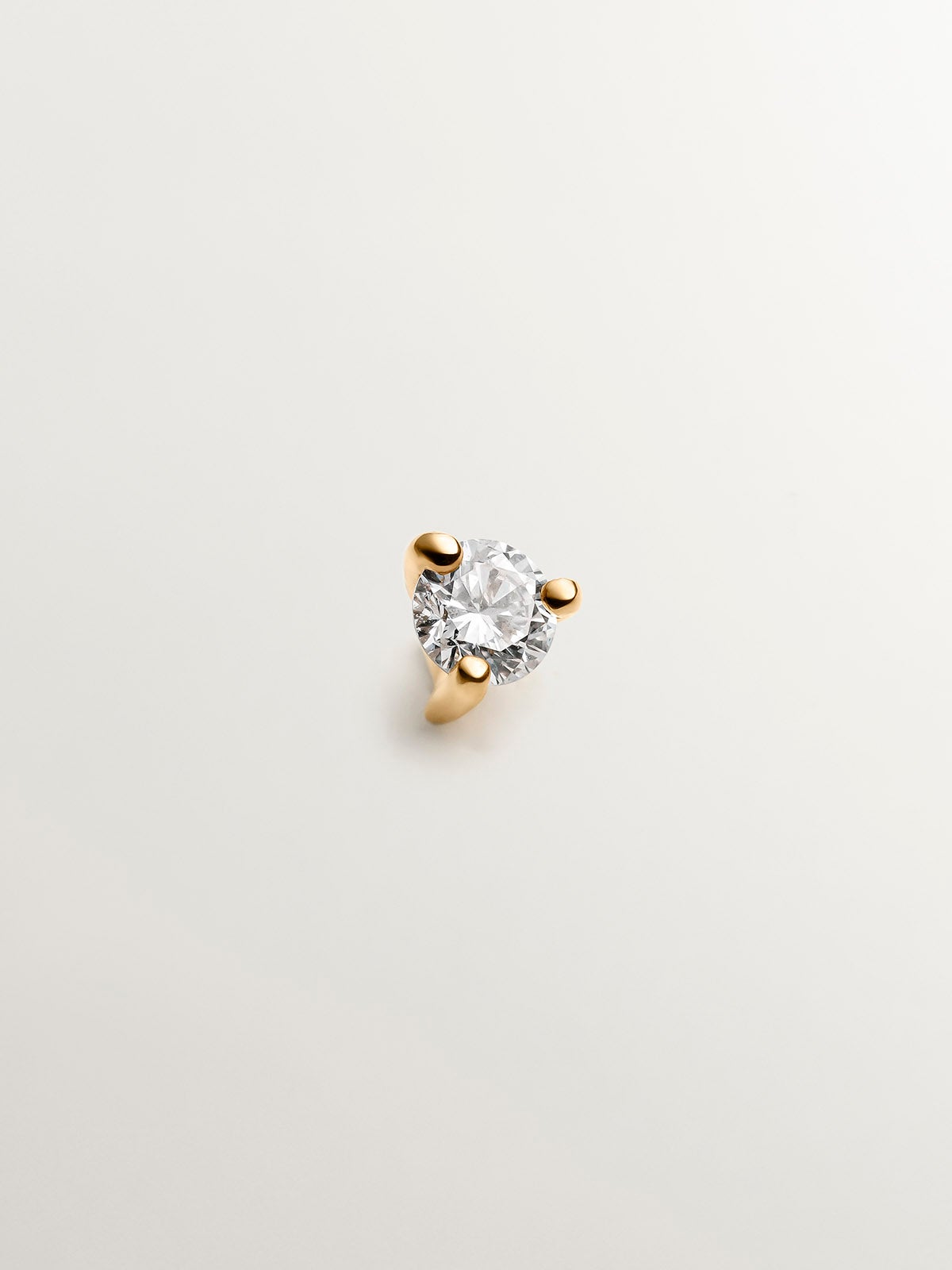 Piercing solitario de oro amarillo de 18K con diamante 0,04 cts