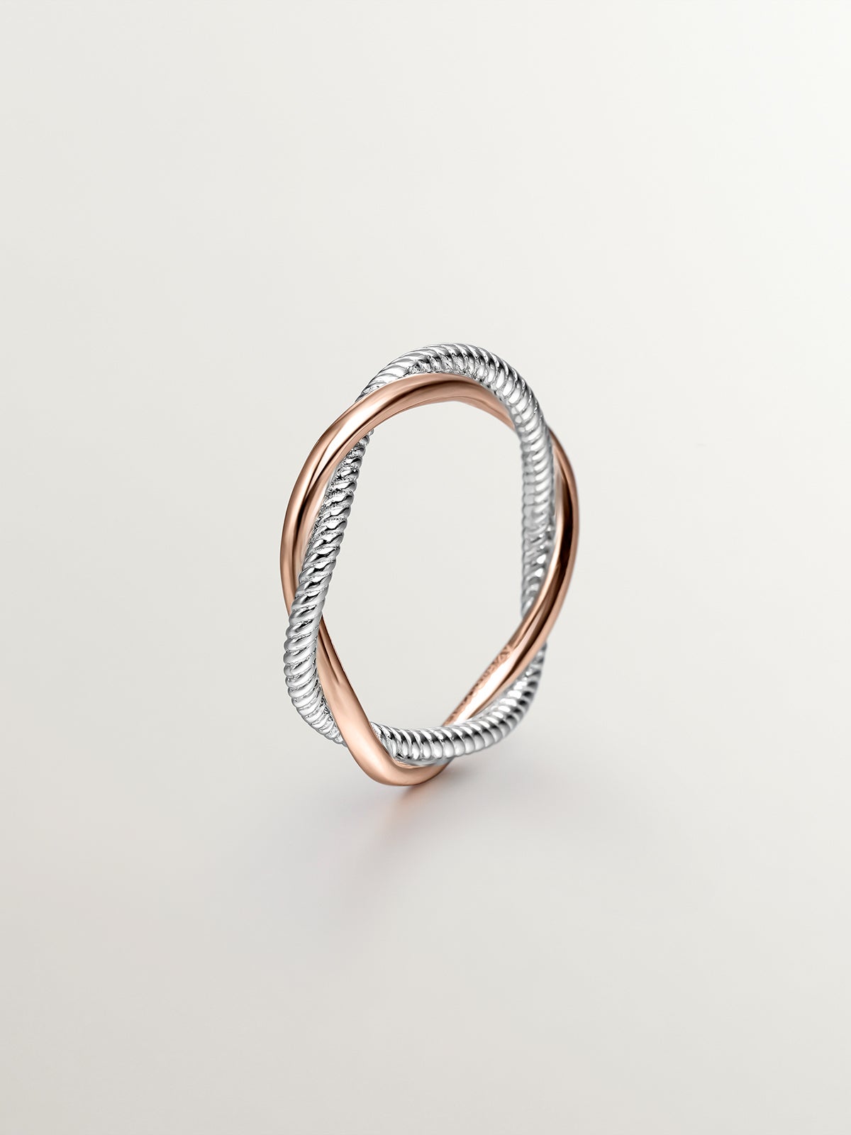 Double twisted ring made of 925 silver bathed in 18K rose gold.