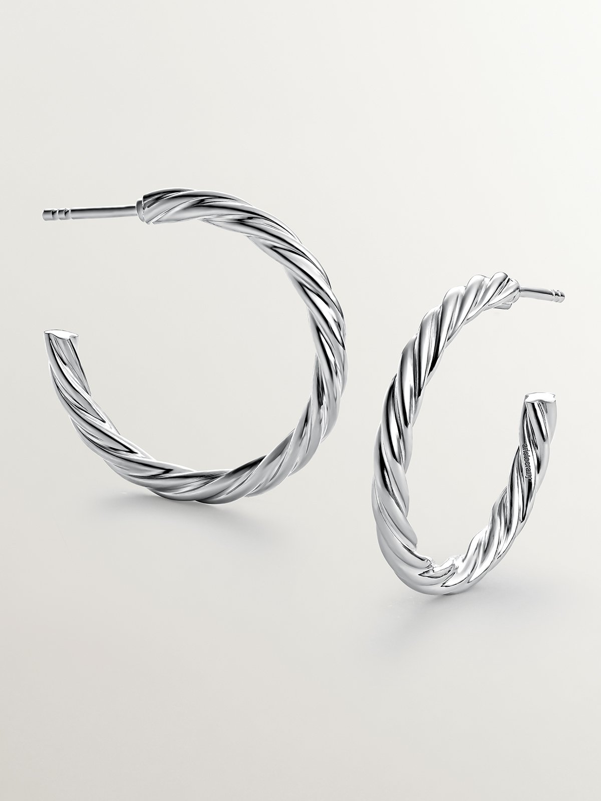 Large 925 sterling silver hoop earrings with fluted texture.