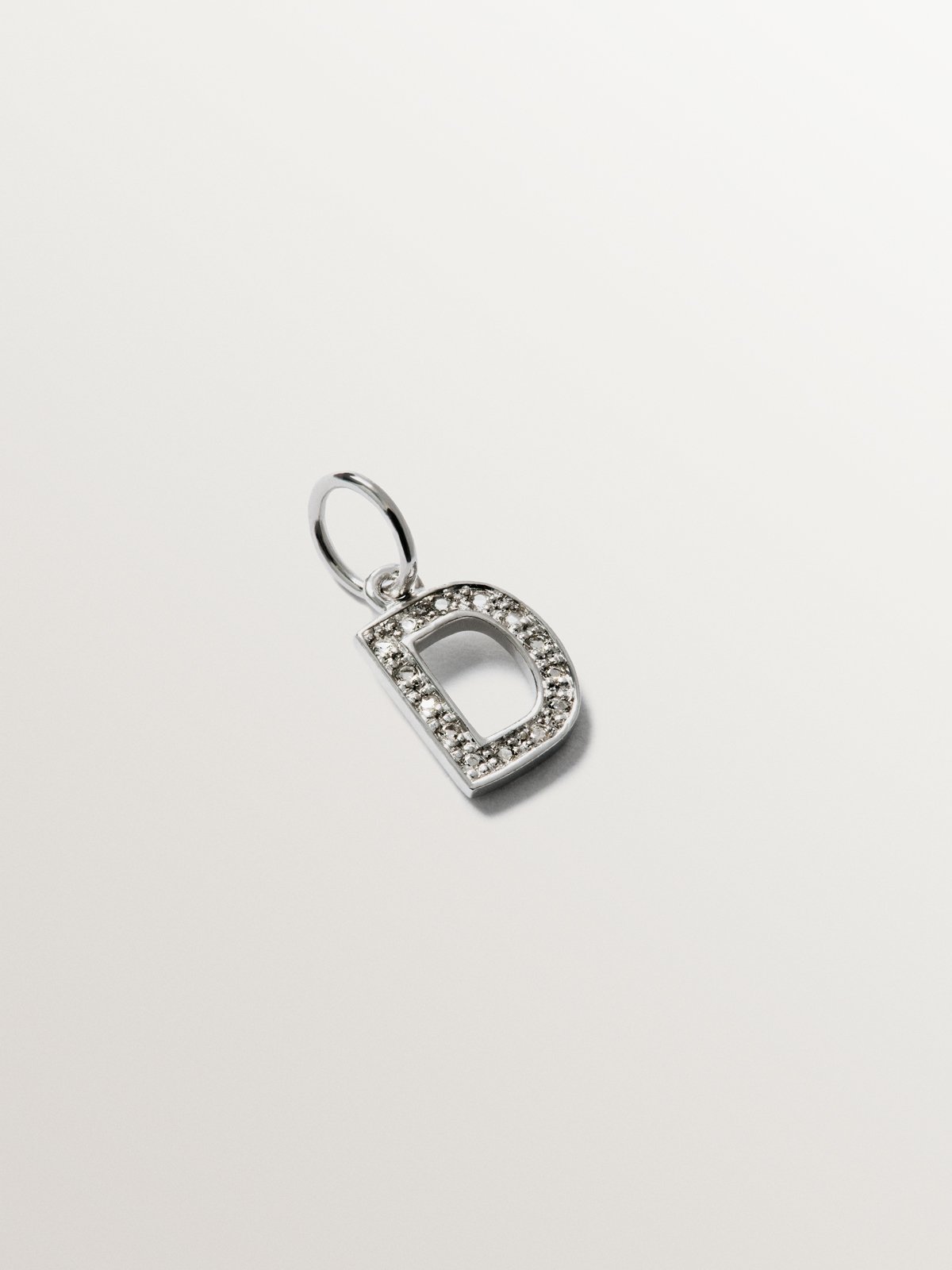 Charm de plata 925 y topacios blancos inicial D