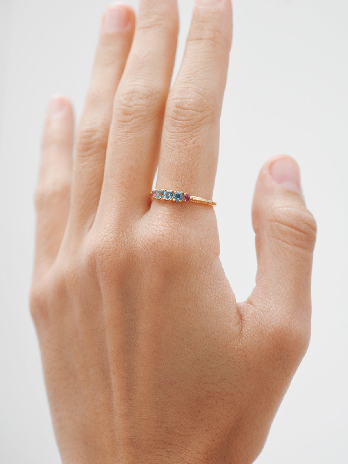 925 Silver ring bathed in 18K yellow gold with topaz and rhodolites.