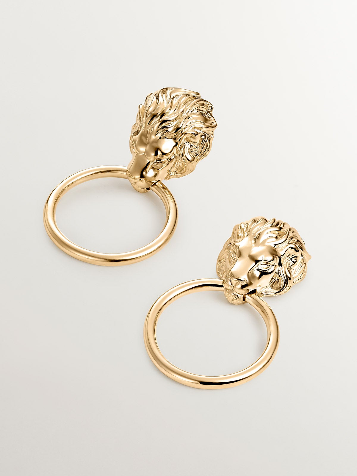 925 Silver earrings bathed in 18K yellow gold with hoop and lion's head.