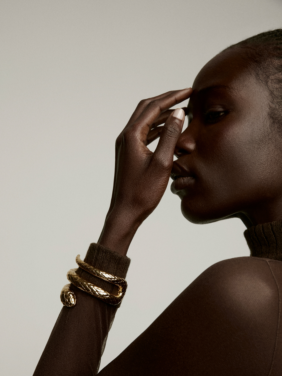 Rigid bracelet made of 925 silver, covered in 18K yellow gold, with a snake shape.