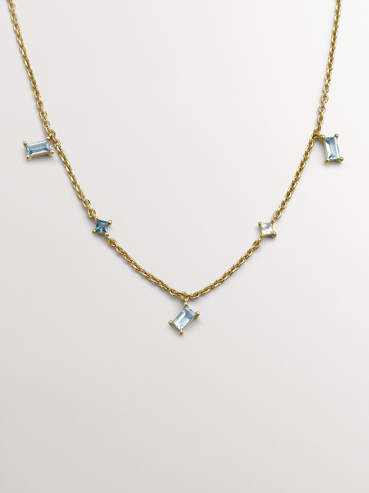 925 silver necklace bathed in 18k yellow gold with blue and white blue and whit
