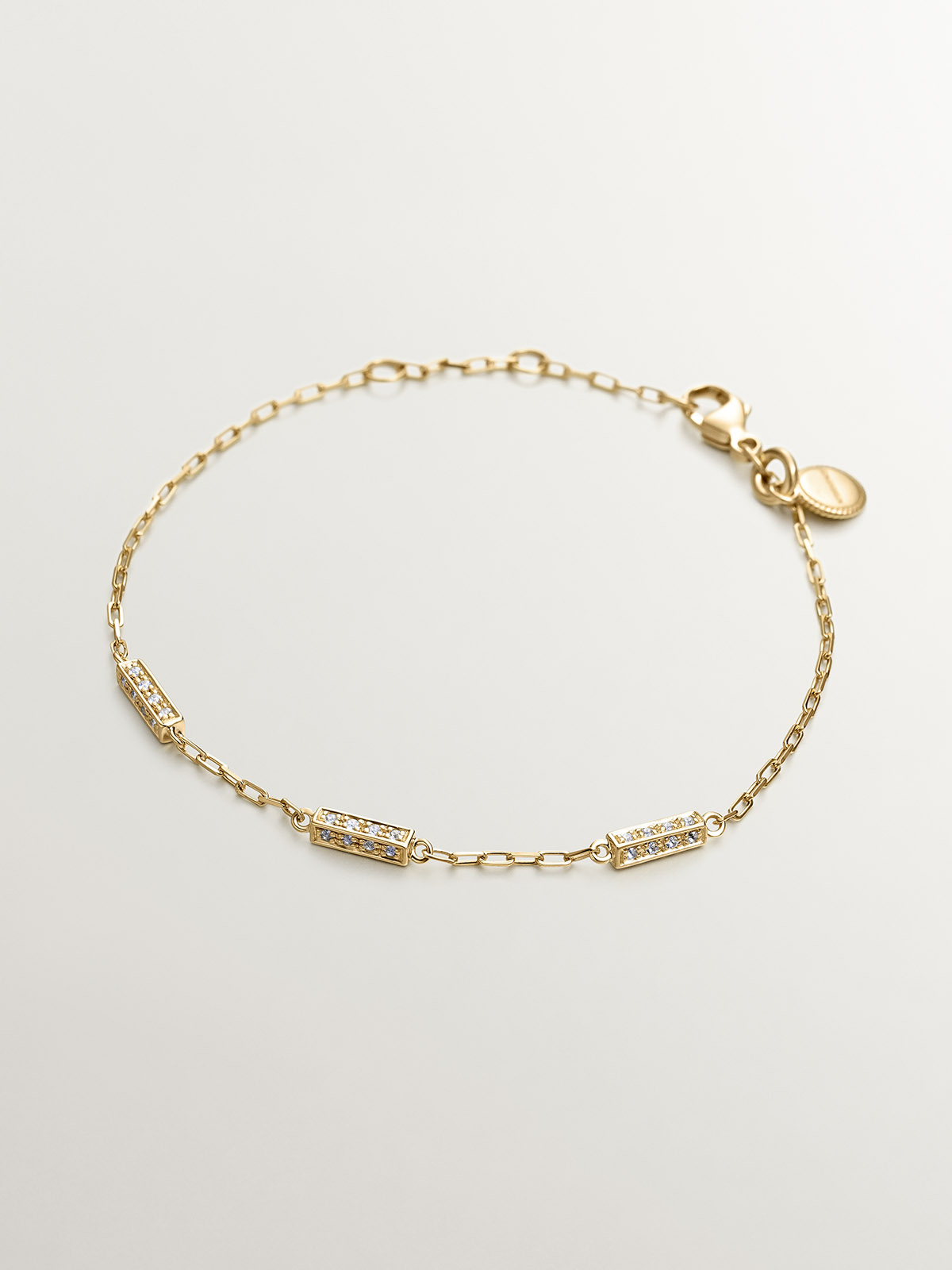 Pulsera eslabones rolo de plata 925 bañada en oro amarillo de 18K con topacios blancos