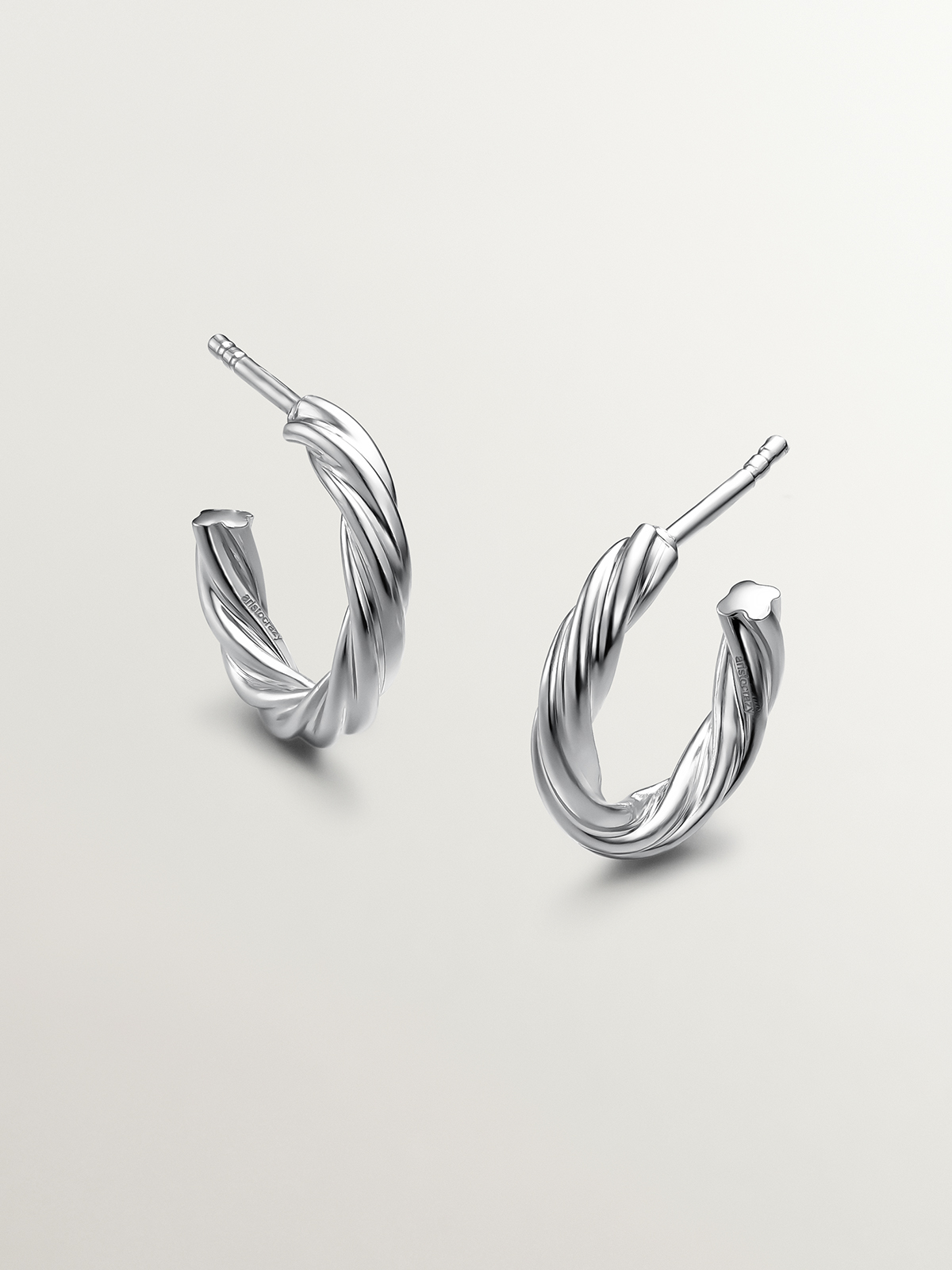 925 Silver hoop earrings with gallooned finish.