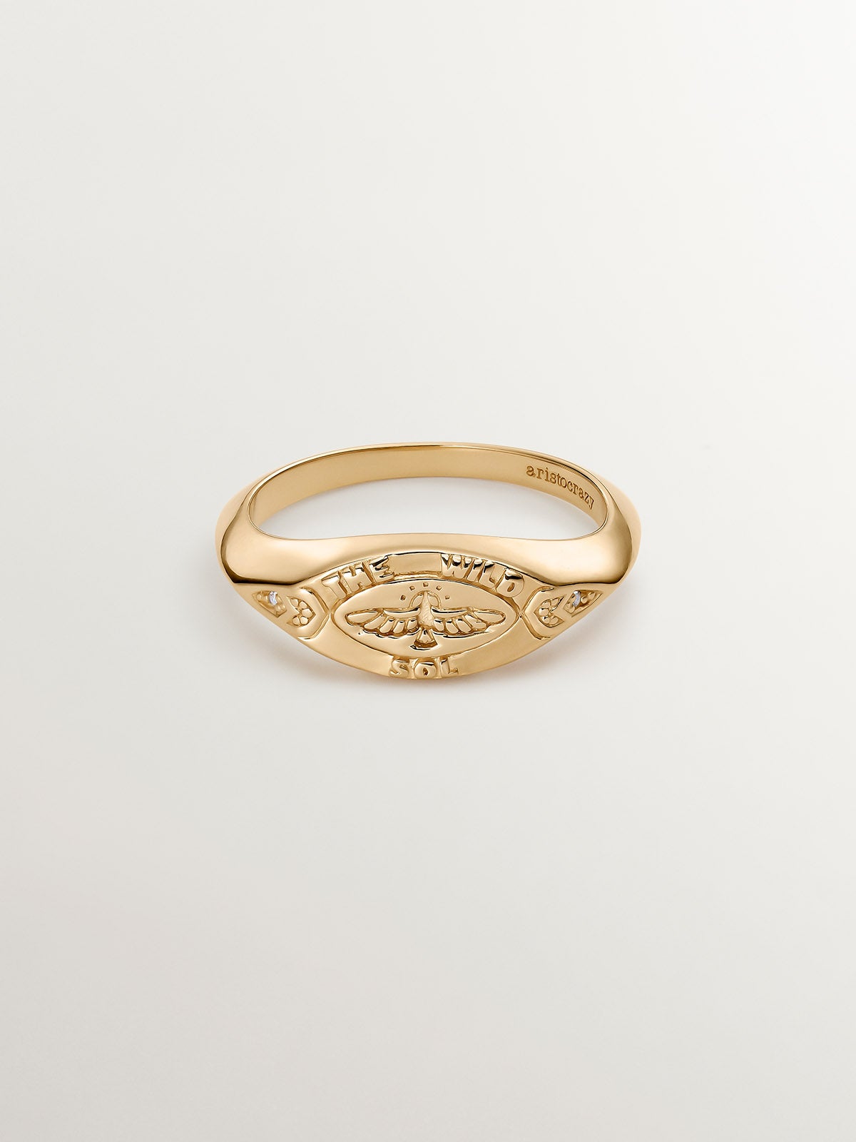 925 Silver seal ring bathed in 18K yellow gold with white topaz and eagle.
