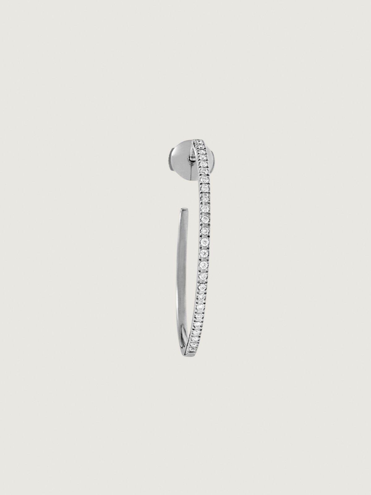 Single large hoop earring made of 18K white gold with diamonds