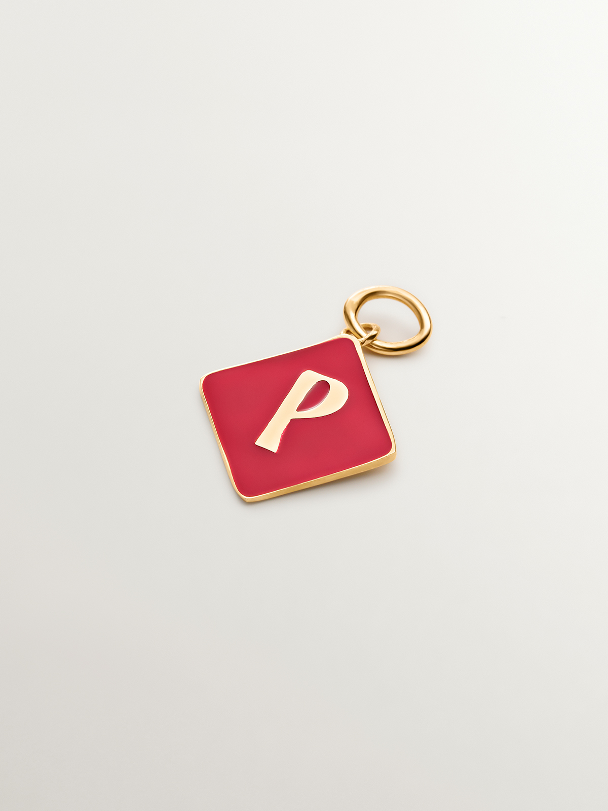 18K yellow gold plated 925 sterling silver charm with initial P and red enamel in diamond shape
