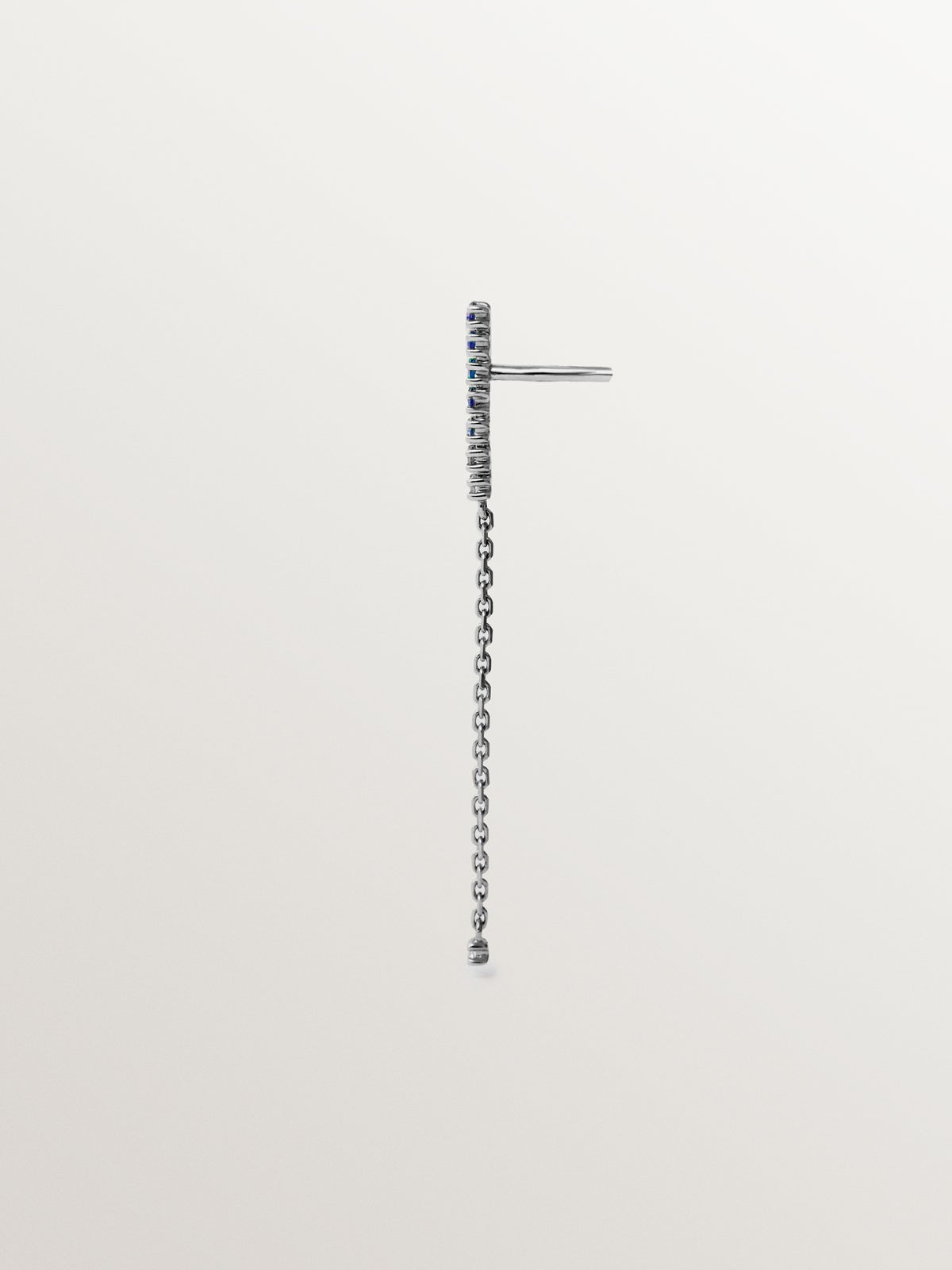 Long individual 9K white gold earring with blue sapphires and diamonds