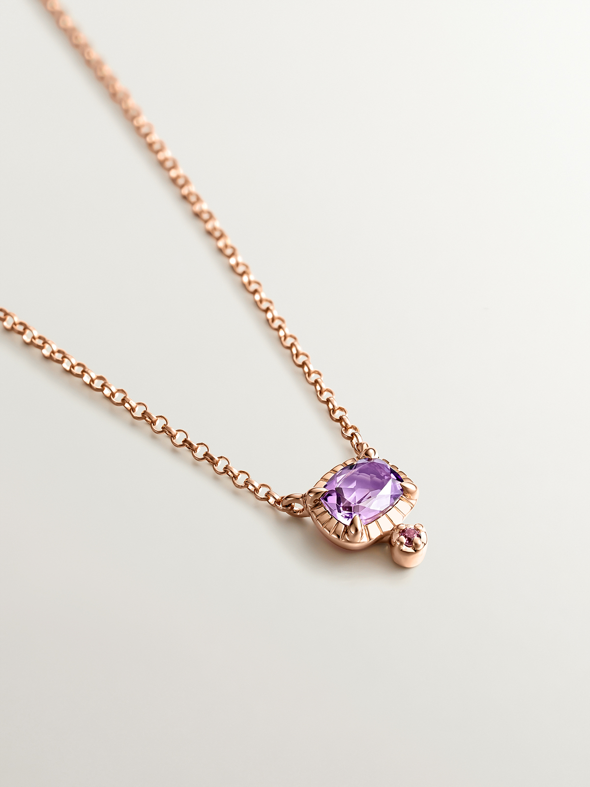 925 Silver pendant dipped in 18K rose gold with purple amethyst and pink rhodolite.