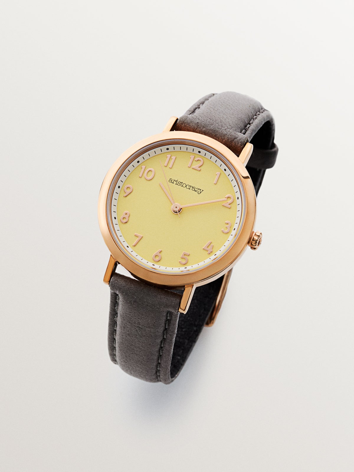 Pink steel venice beach with gray leather strap and yellow sphere