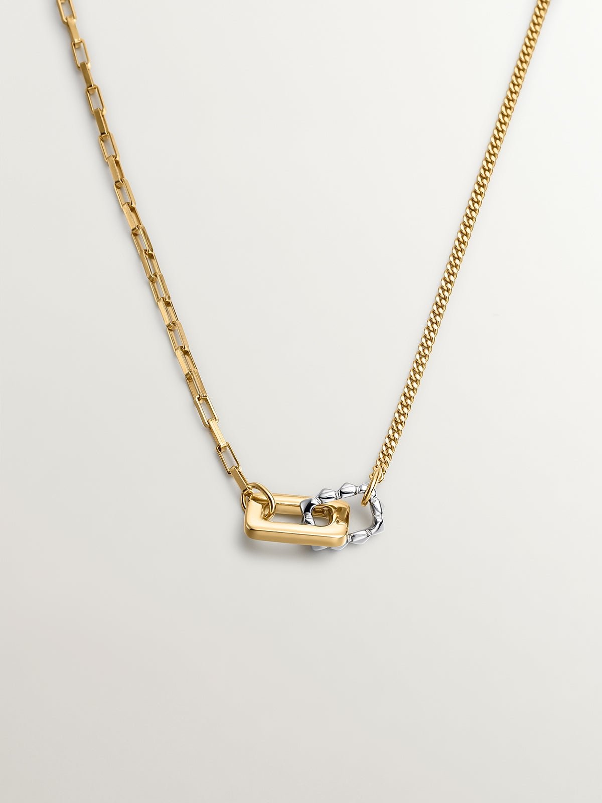 Bicolor pendant of 925 silver and 925 silver bathed in 18K yellow gold with geometric shapes.