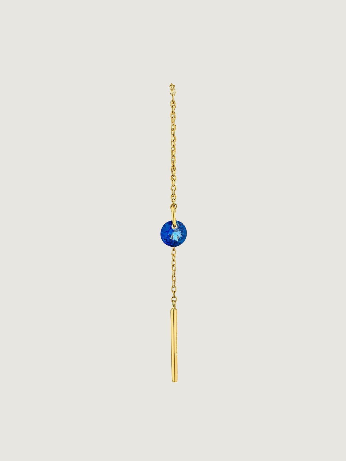 Single 9K yellow gold earring with chain and blue sapphire.